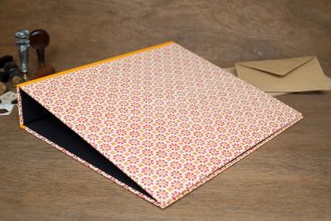 orange,yellow folder with geometric pattern